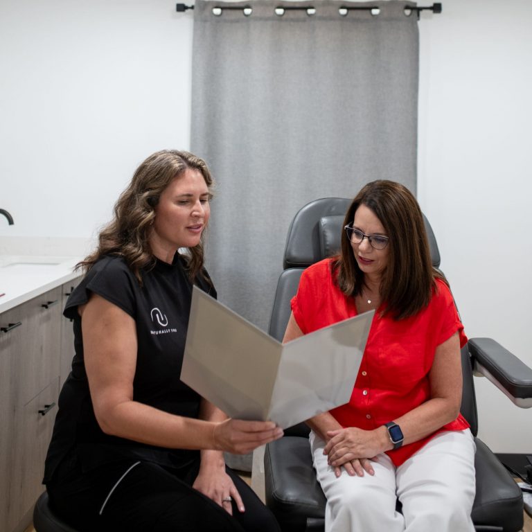 Doctor going over beauty treatment options with patient